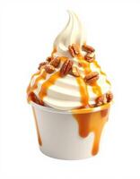 Delicious soft serve ice cream topped with caramel sauce and crunchy pecans served in a cup photo