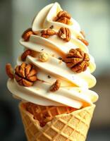 Delicious ice cream cone topped with crunchy pecans served in a waffle cone during summer afternoon photo