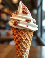 Unique ice cream cone with pecans and swirl topping in a cozy dessert shop photo