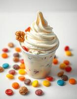 Delicious ice cream sundae topped with whipped cream and colorful candy on a light background photo