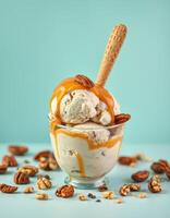 Decadent ice cream topped with caramel sauce, nuts, and a waffle cone against a pastel blue background photo