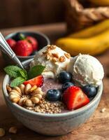 Delicious smoothie bowl topped with fruits and ice cream served for breakfast or dessert photo