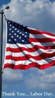 Waving American flag with clouds in the background on Labor Day celebration photo