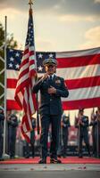 Officer saluting while holding the American flag during a military ceremony in early evening light photo