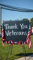 Community tribute for veterans with a heartfelt message displayed on a chalkboard surrounded by patriotic decorations photo