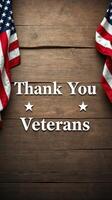 Thank you veterans displayed prominently with American flags against a wooden backdrop photo