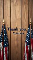 Thank you message honoring veterans alongside two American flags on a wooden backdrop photo