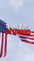 American flag waving in the wind with a message honoring veterans and their service to the country photo