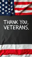 Patriotic display honoring veterans with an American flag backdrop and heartfelt gratitude message photo
