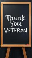 Thank you message written on a chalkboard to honor veterans during a recognition event photo
