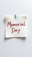 Memorial Day reminder on a note clipped to a wall, symbolizing remembrance and honor during the commemorative holiday photo