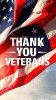 Flag waving with message honoring veterans in a patriotic display during a sunny day photo