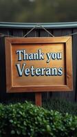 Thank you veterans sign displayed in a well-kept garden during a sunny afternoon photo