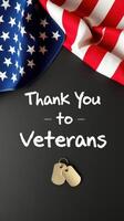Veterans appreciation display with American flags and military dog tags on a dark background photo