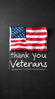 Thank you veterans flag displayed on a blackboard with heartfelt message on Veterans Day photo