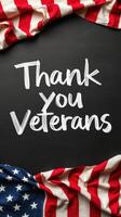 Thank you veterans displayed with American flags on a blackboard background during Veterans Day celebration photo