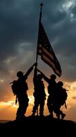 Soldiers honor their nation while raising the flag against a dramatic sunset backdrop in a moment of unity and pride photo