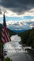 Thank you veterans for your service by a serene river under a cloudy sky surrounded by mountains photo