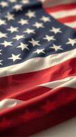 US flag draped gracefully, showcasing vibrant colors in a traditional display photo