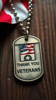 Gratitude expressed through a veteran's dog tag showcasing the American flag on a wooden table photo