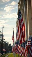 Flags wave proudly in the sunlight at a historical monument, showcasing patriotism and community spirit in the early evening hours photo