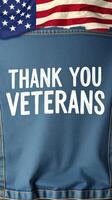 Thank you veterans display on a blue garment with American flag accents at a patriotic gathering event photo