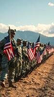 Soldiers stand in formation with American flags during a military ceremony in a scenic location at sunset photo
