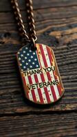 Military dog tag displaying gratitude to veterans with American flag design on a rustic wooden surface photo