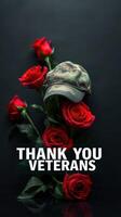 Tribute to veterans with red roses and military cap against a dark background photo