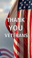 Thank you veterans for your service and sacrifice displayed under the American flag on a clear day photo