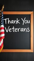Creative display expressing gratitude to veterans with an American flag and a chalkboard message in a cozy indoor setting photo