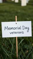 Memorial Day tribute honoring veterans in a serene cemetery setting with green grass photo