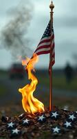 Flames dance around a U.S. flag on a somber day amidst a blurred gathering in the background photo