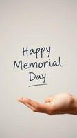 Message celebrating Memorial Day written in a casual style held above an open hand against a plain background photo