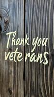 Thank you veterans sign made from dark wood with engraved lettering in a rustic style photo