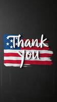 Thank you message with American flag design on a dark background for patriotic celebrations or greetings photo