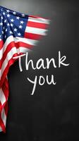 Patriotic message of gratitude displayed with an American flag on a black background in a creative setting photo