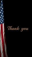 Flag displayed alongside a heartfelt message of gratitude during a patriotic event in a solemn atmosphere photo