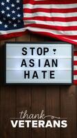 Message promoting unity against hate displayed with American flags and a wooden background photo