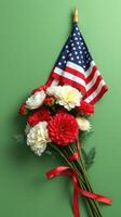 Colorful bouquet of red and white flowers with an American flag on green background photo