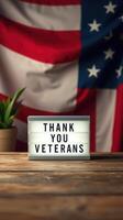 Veterans Day celebration with gratitude message in front of American flag and plant photo
