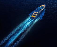 Luxurious yacht gliding through deep blue waters at twilight with stunning wake trails photo