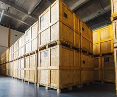 Large storage area filled with wooden crates organized in stacks for inventory management in a warehouse environment photo