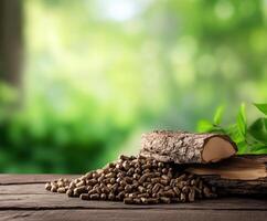 Wood pellets stacked neatly next to a log on a wooden surface with a green natural background photo
