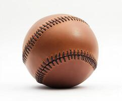 Baseball resting on a surface, showcasing its detailed stitching and texture in a minimalistic setting photo
