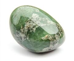 Beautiful green stone with unique patterns showcasing natural textures and hues in a close-up view photo