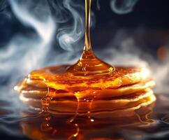 Golden syrup drizzles over fluffy pancakes in a warm kitchen setting during breakfast time photo