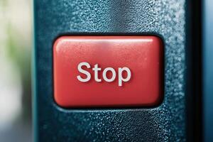 Close-up of a red stop key on a black keyboard with faded colors highlighting the key's significance and use in various applications photo