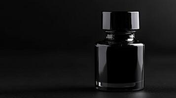 Black ink bottle stands out against a dark background, showcasing sleek design and glossy finish, perfect for artistic creations photo