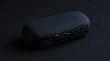 Elegant black eyeglass case displayed on a dark surface highlighting its texture and design simplicity photo